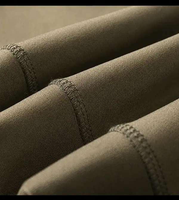 Camouflage tactical fleece-lined long-sleeve training top for outdoor activities and cool weather.