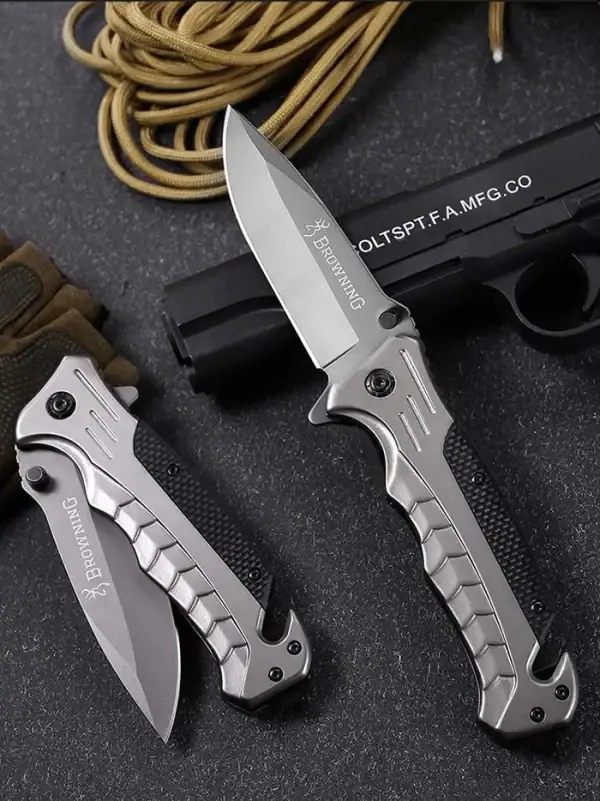 K25 Browning G10 Tactical Folding Knife in Space Grey with glass breaker and rope cutter.