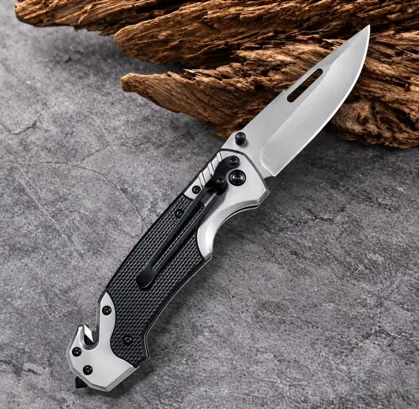 K04 Titanium-Plated 3cr13 stainless steel tactical folding knife with black handle and silver blade.