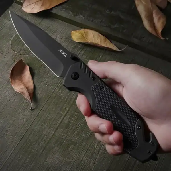K17 VERGE all-black tactical folding knife with glass breaker and rope cutter for outdoor survival.