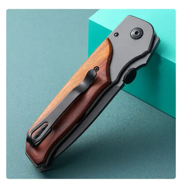 K15 Browning Redwood tactical folding knife with 3.5mm blade, wooden handle, outdoor survival gear.