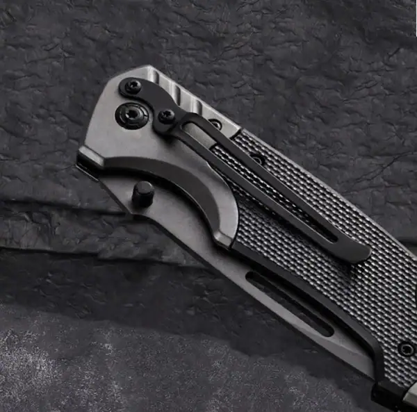 K04 Titanium-Plated 3cr13 Stainless Steel tactical folding knife with black handle for outdoor survival and rescue.