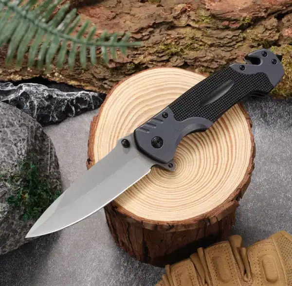 K09 High-Hardness Tactical Folding Knife with smooth blade and glass breaker, black handle, outdoor survival tool.