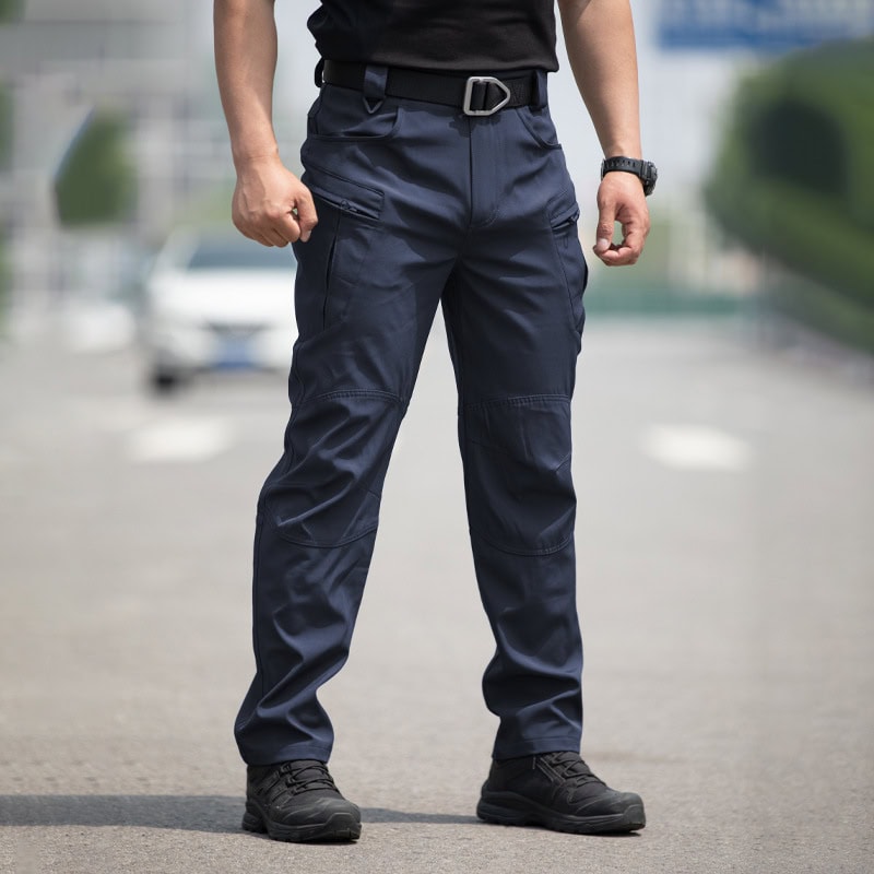 Men's lightweight tactical cargo pants in navy blue with multiple pockets for outdoor and training use.