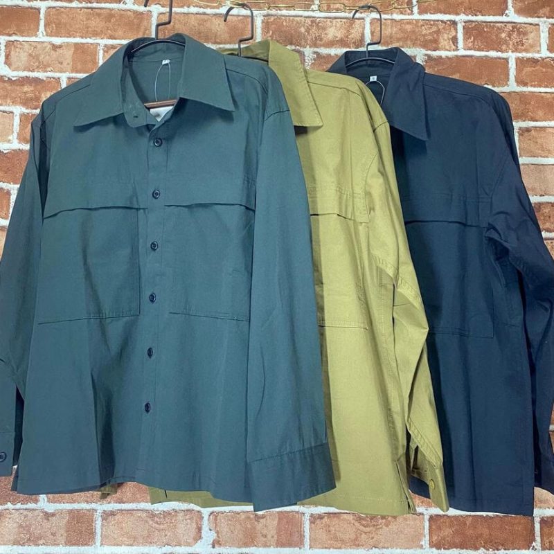 Long-sleeve tactical shirts in green, khaki, and navy blue for outdoor use.