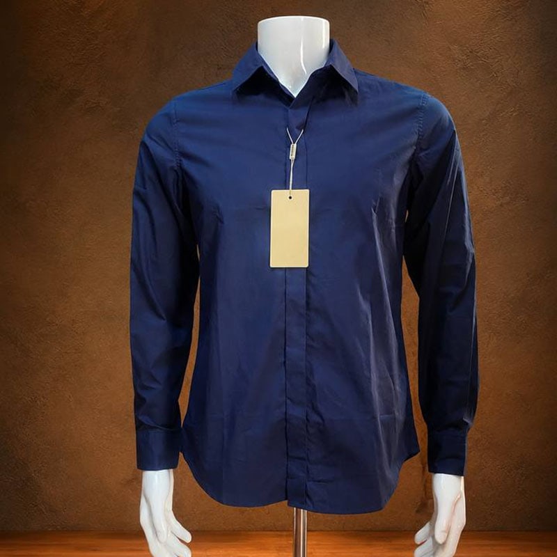 Navy long-sleeve casual shirt with classic collar and button closure, displayed on a mannequin.