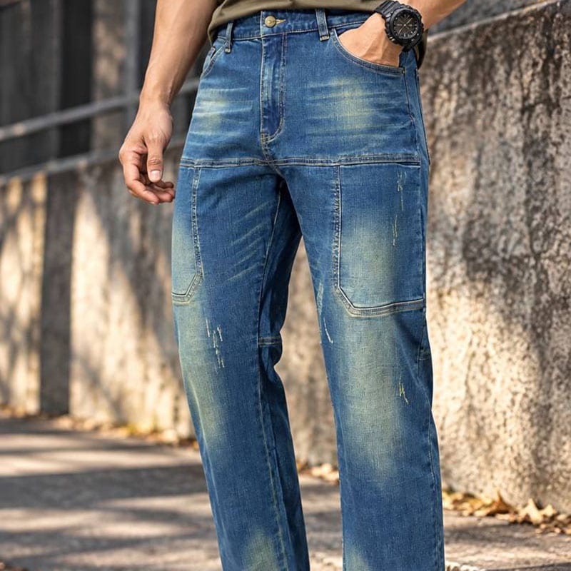 Men's washed denim utility jeans with straight-leg style in blue, featuring tactical design details.