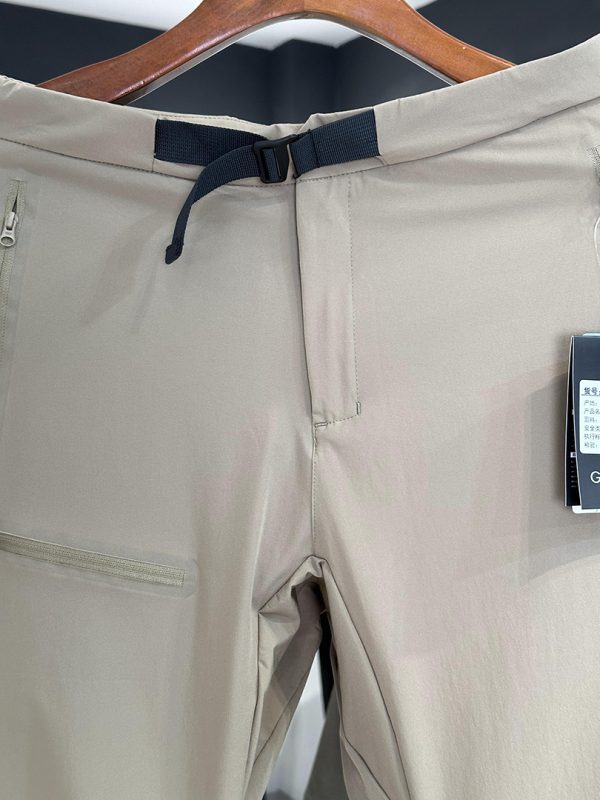 IX31 Men's Lightweight Softshell Outdoor Pants with built-in belt and zipper pockets in beige style.