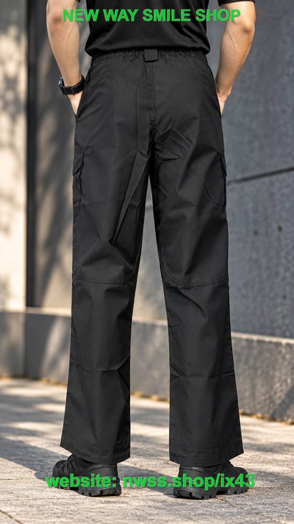 Black tactical cargo pants with utility pockets and D-ring details for outdoor and tactical use.