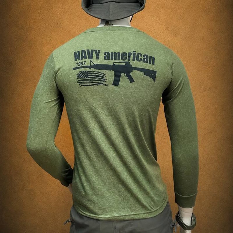 Green tactical long-sleeve shirt with Navy American graphic and firearm print on back.