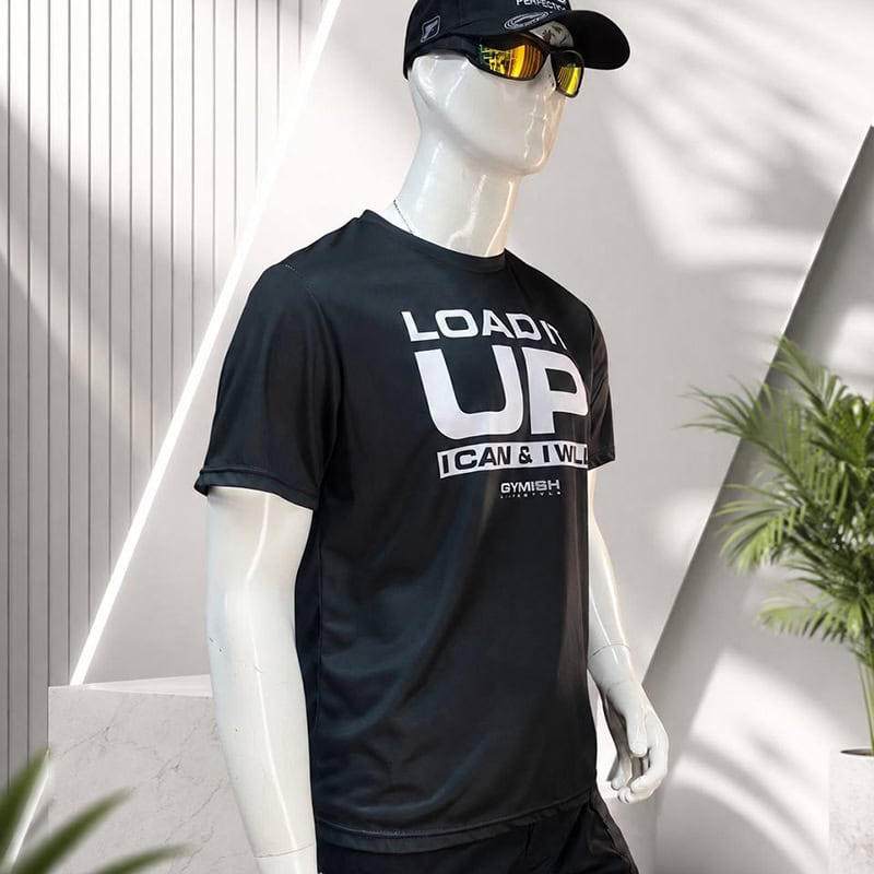 TSS50 Black Performance Graphic T-Shirt for daily training and outdoor wear on a mannequin with sunglasses and cap.