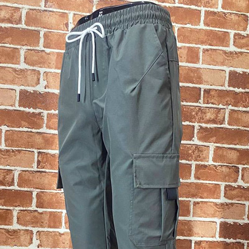 IX28 lightweight cargo pants with elastic waist and side utility pockets in gray color.