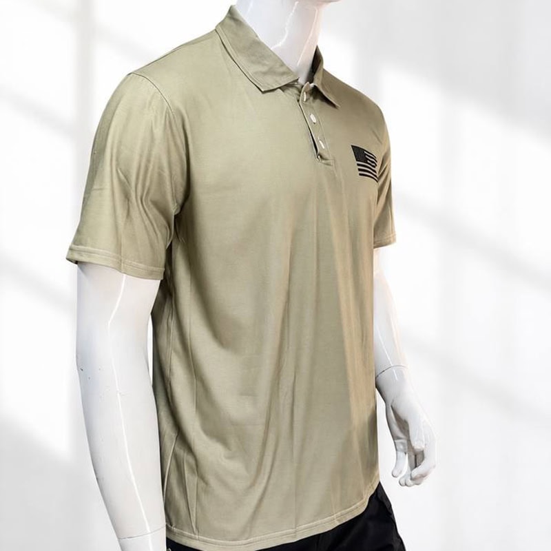 Olive tactical polo shirt with black flag-style chest graphic, short-sleeve, collared, tactical outdoor style.
