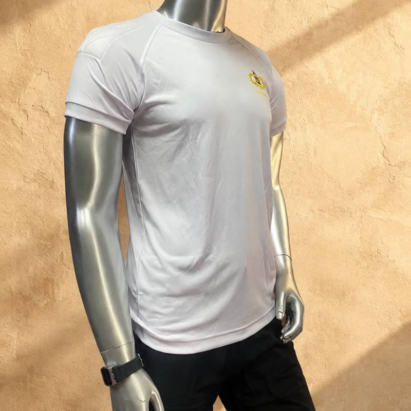 White athletic T-shirt with raglan seams and gold-tone chest crest on a mannequin.