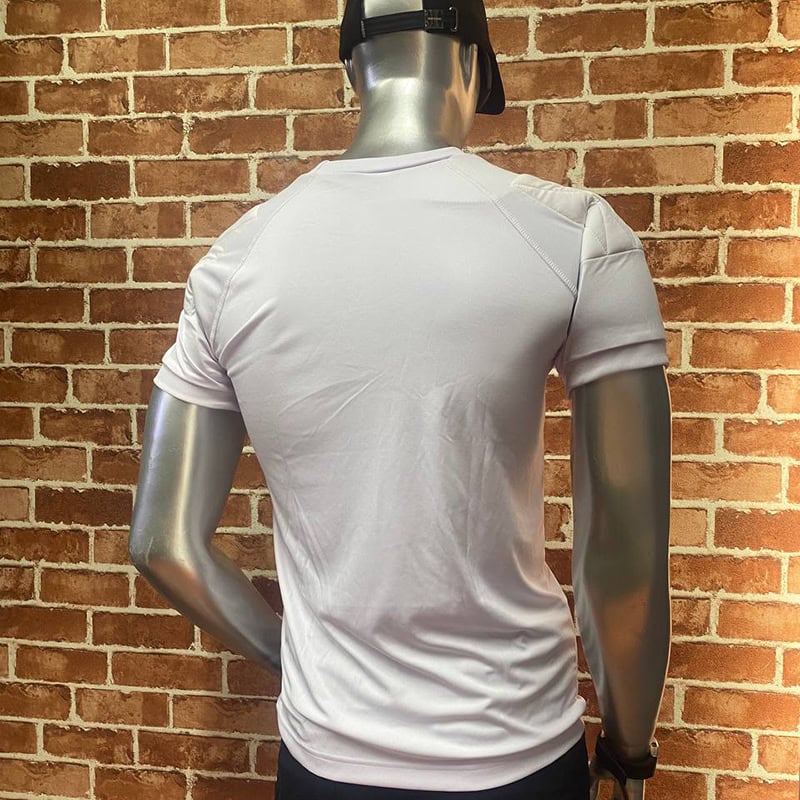 White tactical T-shirt with structured shoulder panels and police chest graphic on a mannequin.