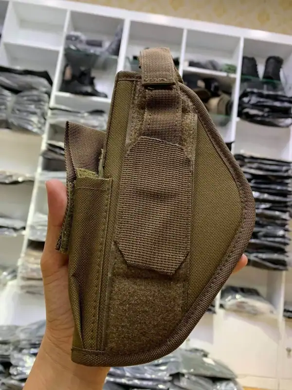 TTH24 Tactical Belt Holster in khaki with adjustable retention strap for tactical use.