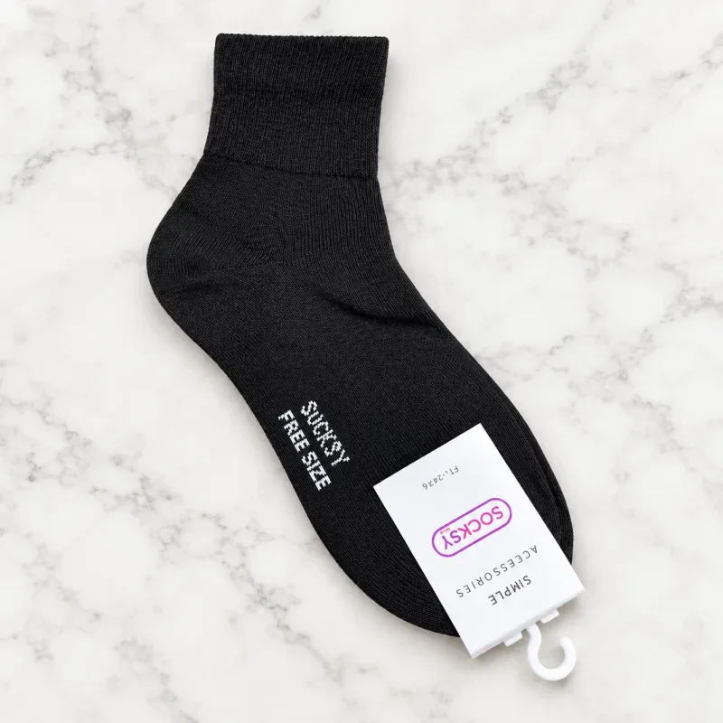 Black sock with Sucksy Free Size label, casual style, suitable for outdoor or tactical use.