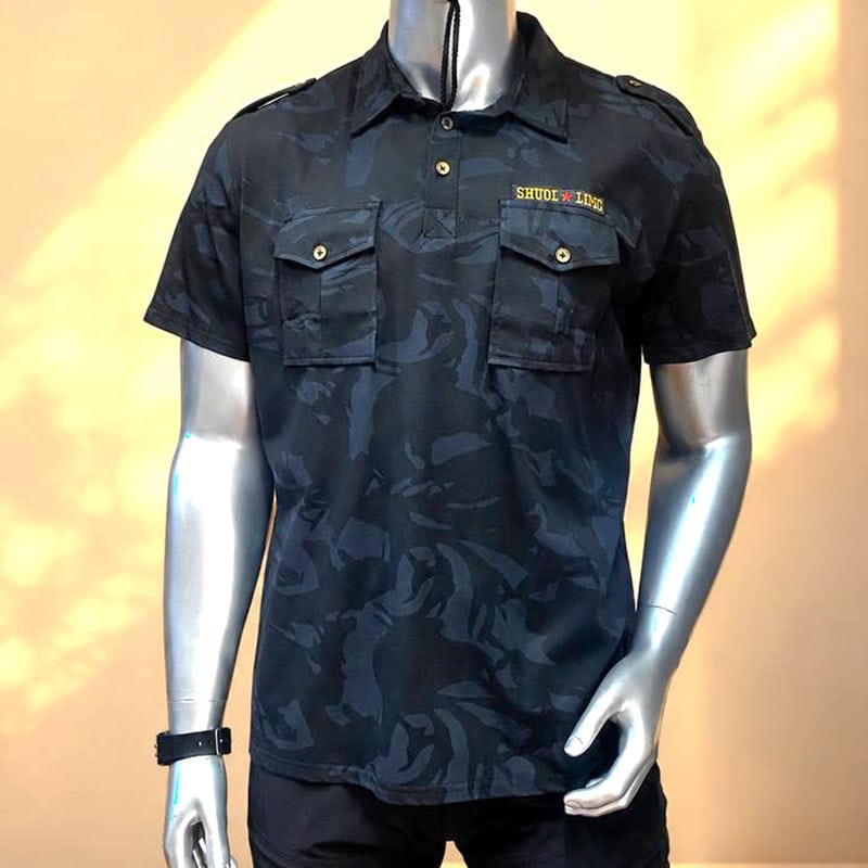 Dark camouflage tactical shirt with chest pockets for outdoor and tactical use.