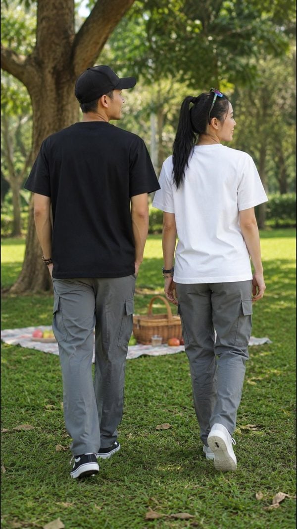 Unisex short-sleeve T-shirt with raised round chest emblem in black and white, casual outdoor style.