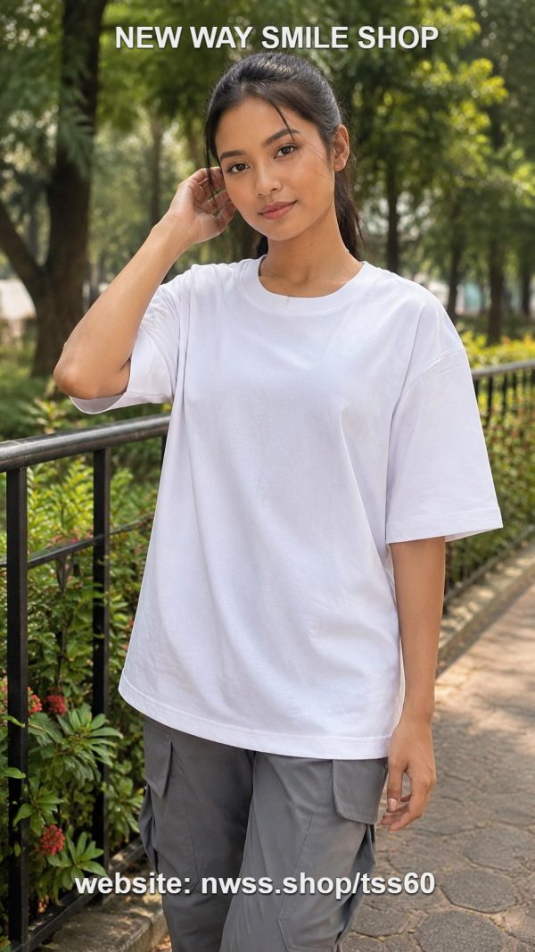 White oversized plain short-sleeve T-shirt for men and women, casual style, outdoor setting.