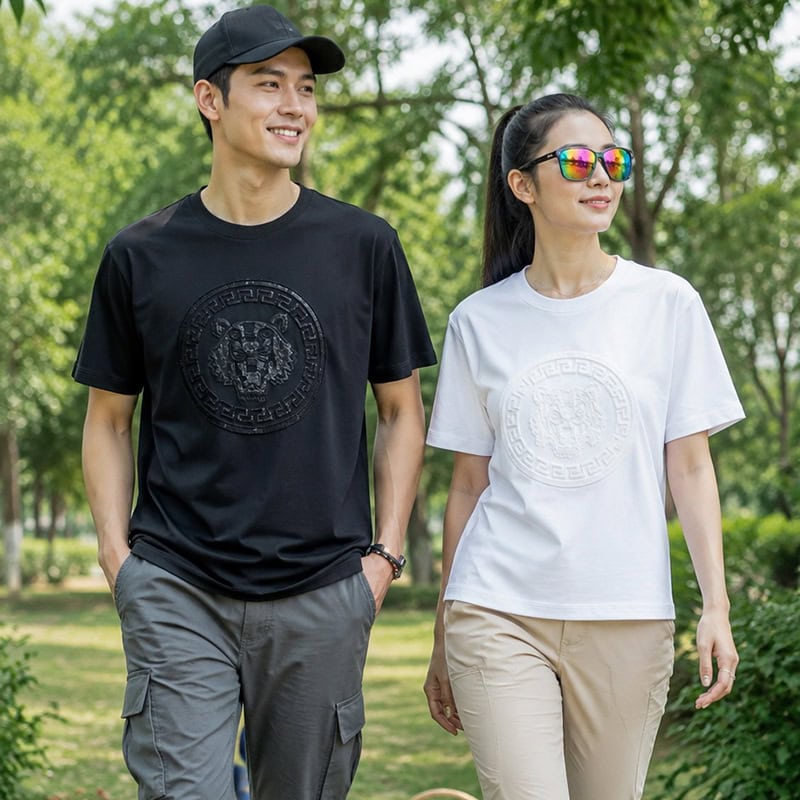 Unisex short-sleeve T-shirt with raised round chest emblem in black and white, casual outdoor style.