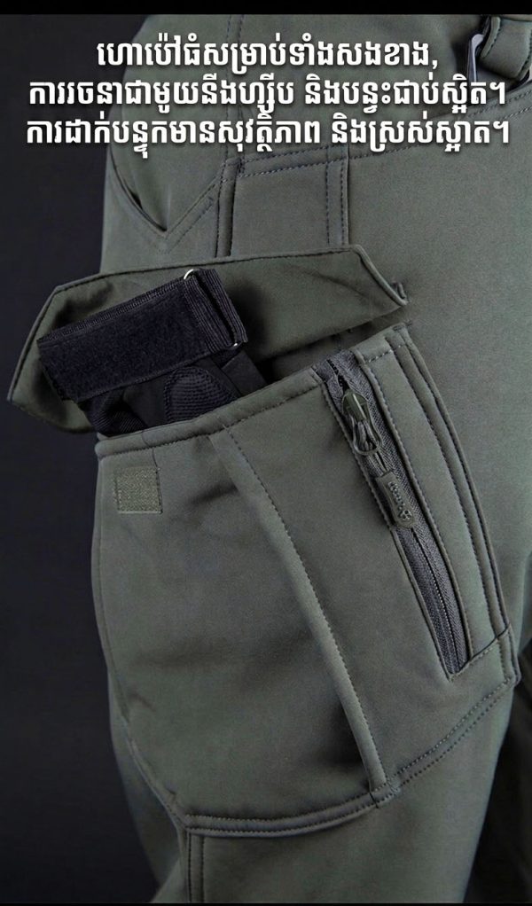 Tactical long sleeve shirt in black with dual chest pockets and wrinkle-resistant fabric for outdoor use.