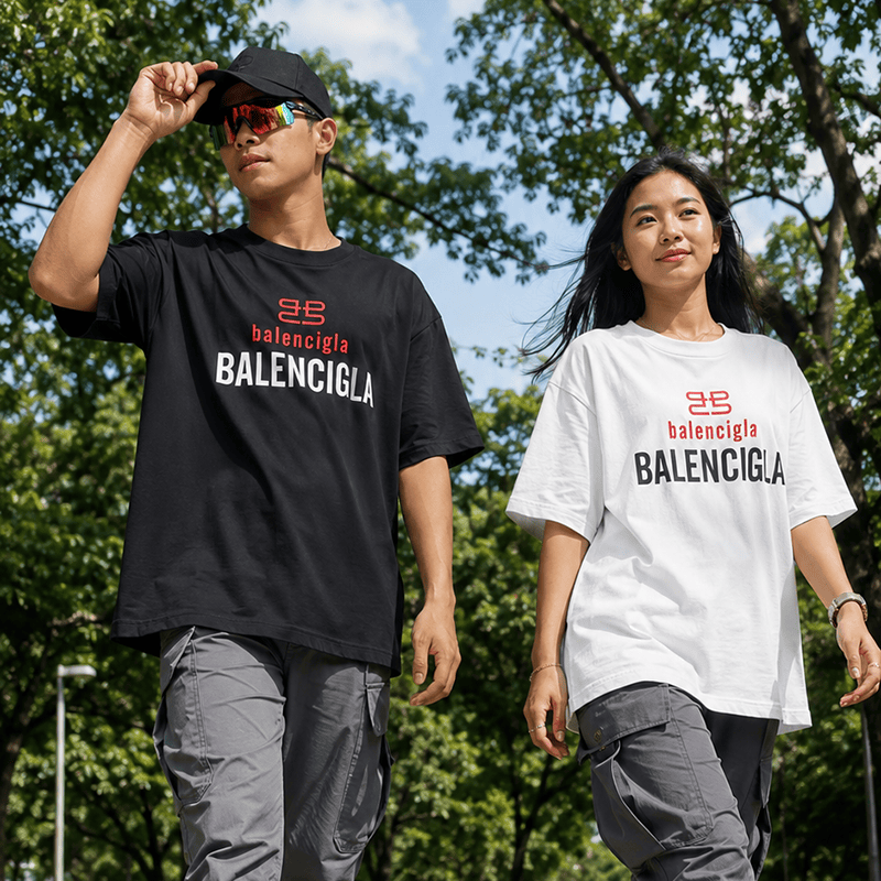Unisex oversized graphic T-shirts in black and white with Balenciaga logo for casual wear.