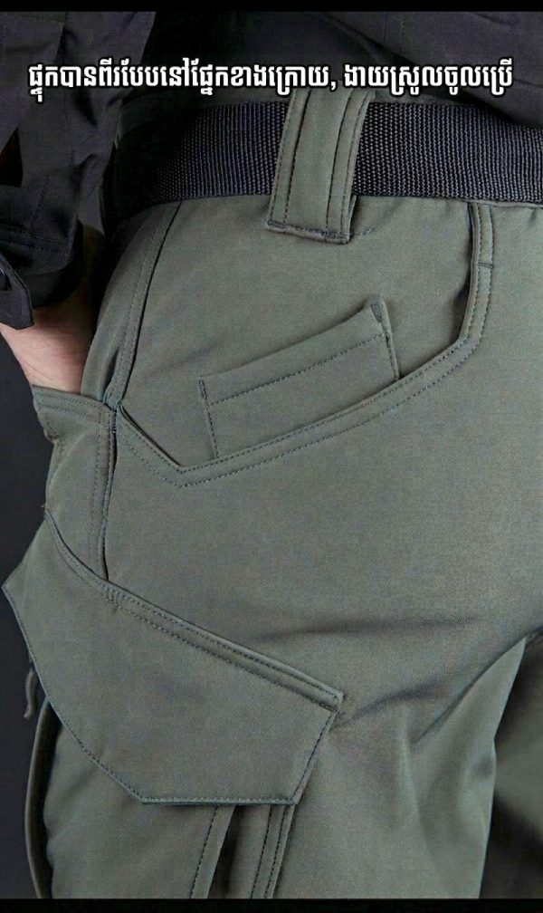 Tactical long sleeve shirt in blue with dual chest pockets, wrinkle-resistant fabric, and button-up front.