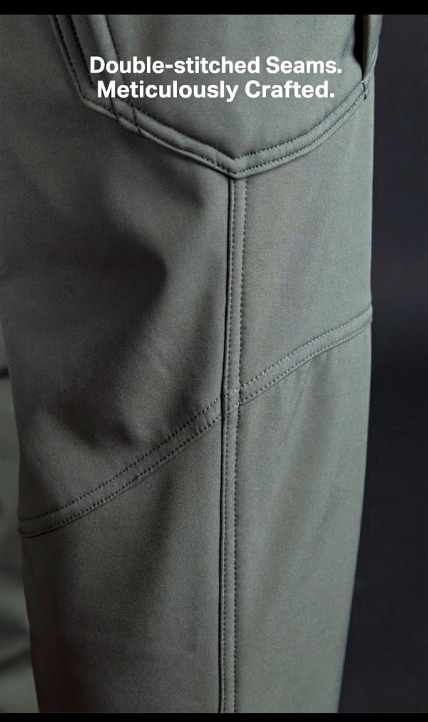 Tactical long sleeve shirt in olive green with dual chest pockets and wrinkle-resistant fabric.