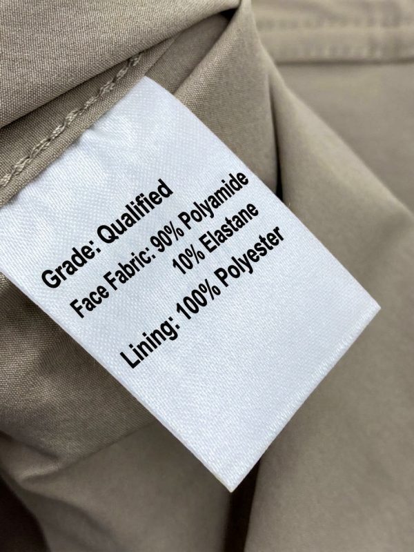 Tactical long sleeve shirt in khaki with dual chest pockets and wrinkle-resistant fabric.