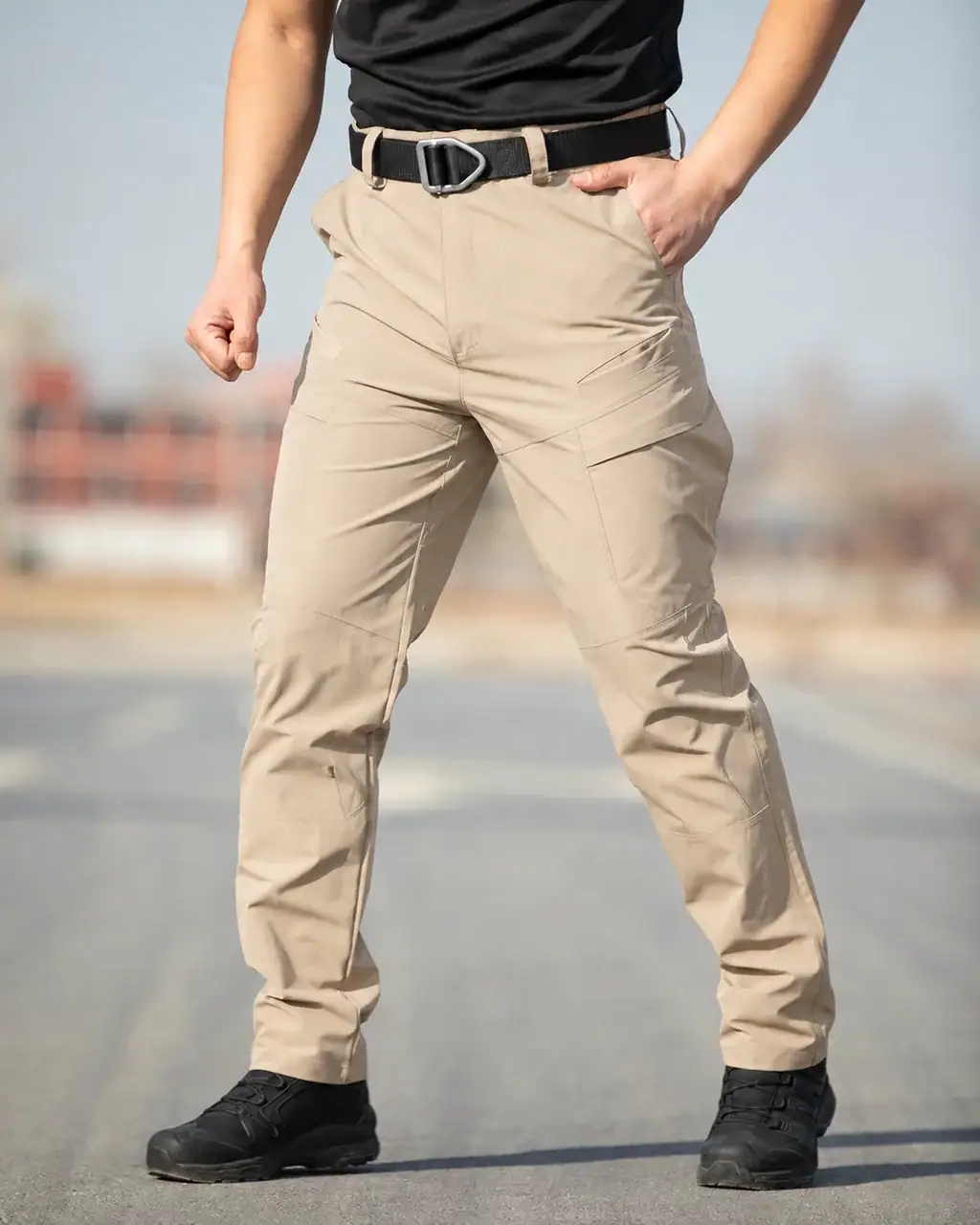 IX57 Men's Water-Resistant Stretch Multi-Pocket Tactical Pants in beige for outdoor activities.