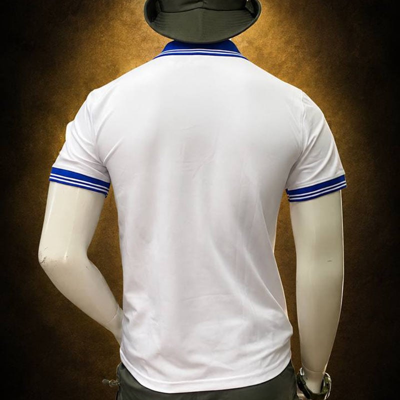 White TSS77 Embroidered Short-Sleeve Polo Shirt with blue accents on collar and sleeves.