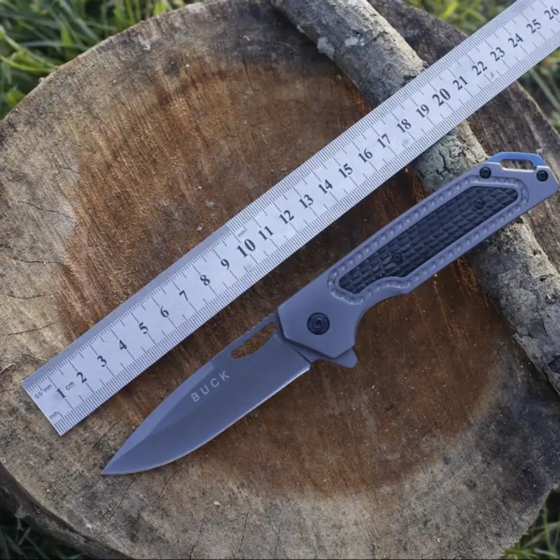 K72 tactical knife with black handle and fixed blade for outdoor use.