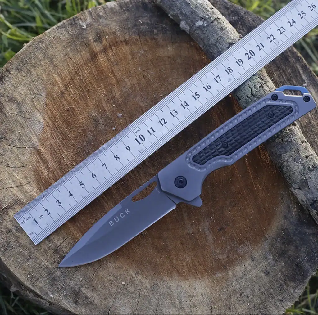 K72 tactical knife with black handle and fixed blade for outdoor use.